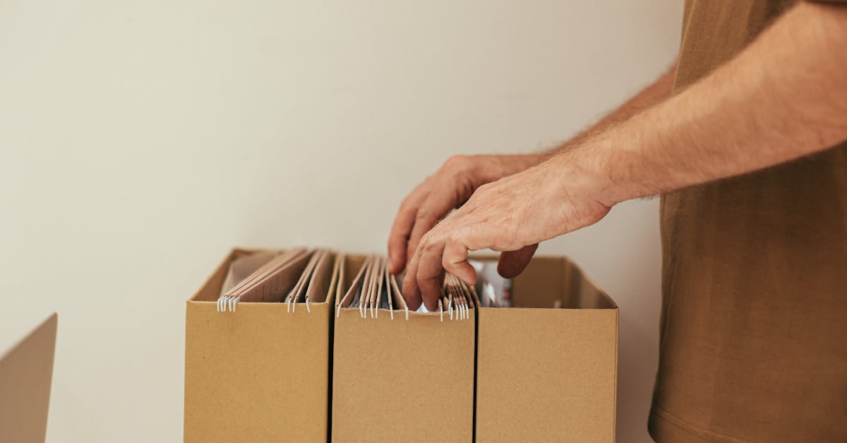 Organized storage boxes and a laptop representing backup retention.