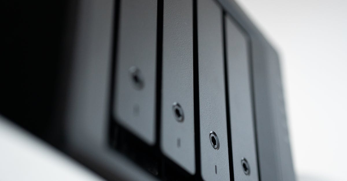 A backup checklist beside a laptop and external drive.